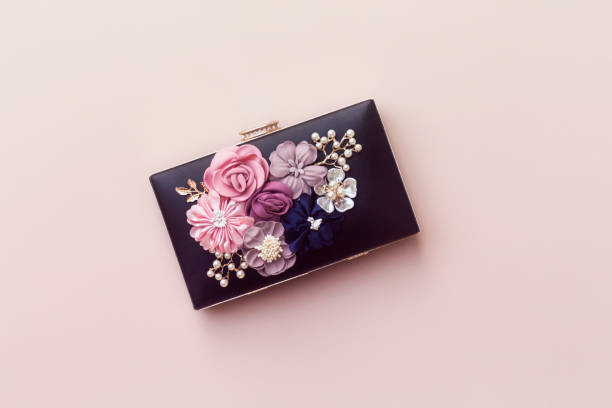 istock beautiful  women black clutch, wedding bag 987645220