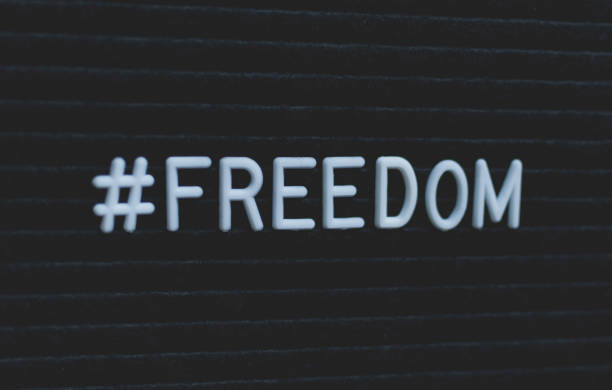 istock Hashtag word #freedom written on the letter board. 987647896