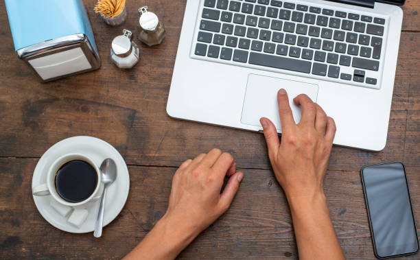 istock Working on laptop in fast food restaurant 987651636