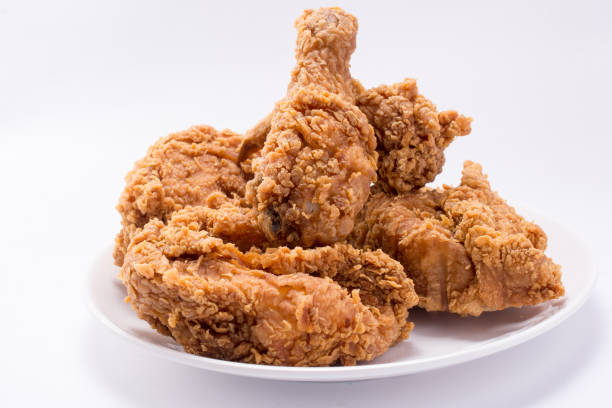 istock Delicious hot and crispy fried chicken isolated on a white background 987651882