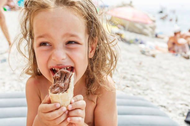 istock Little boy eating an ice cream 987655204