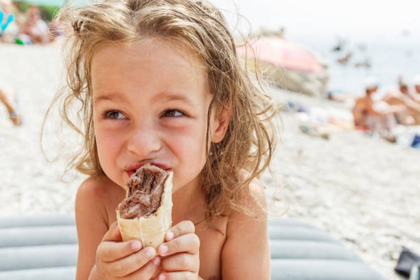 istock Little boy eating an ice cream 987655258
