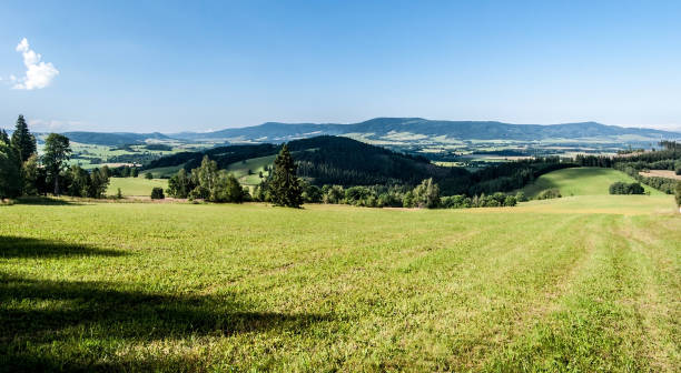 istock beautiful landscape scenery with meadows, Orlicke hory mountain range on the background and rural landscape in Czech republicrs 987662246