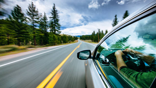 road trip  - rear view mirror car mirror rear view stock-fotos und bilder