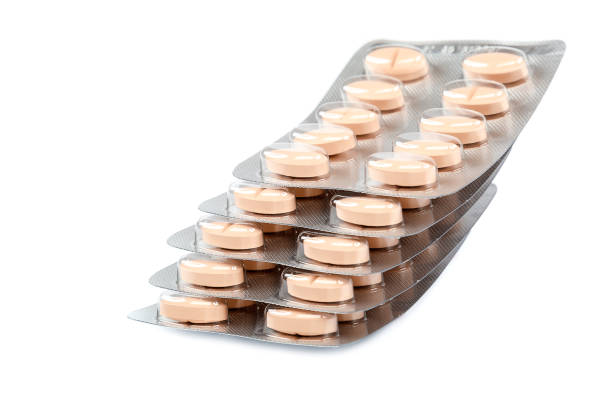 istock Pills in blister packs on white background. 987685504