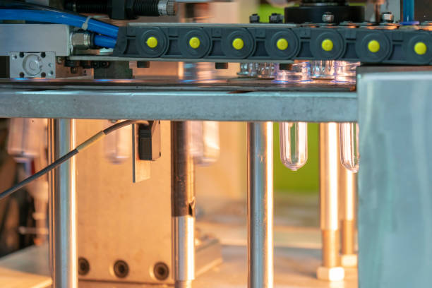 istock The preform shape of plastic bottle product in the heater for preheating process. 987701992