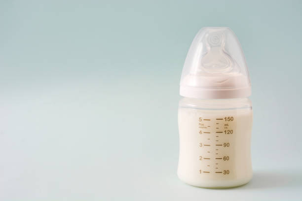 istock Baby bottle and milk 987708664