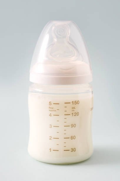 istock Baby bottle and milk 987708936