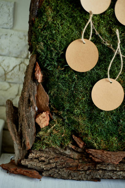 istock Seating plan, wedding decor in rustic style.Moss, bark, wood, crafting cards. Close details 987731234