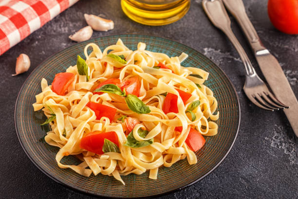 istock Pasta with tomato sauce served with basil 987734154
