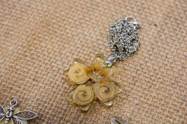 istock pendant with flower petal inside resin 987774694