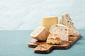 Variety of cheeses on serving board