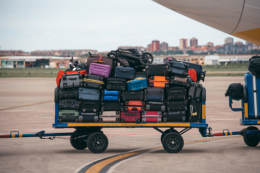 A cart full of luggage in an airport