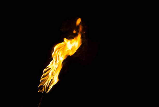 istock flame of a torch in the dark 987797904