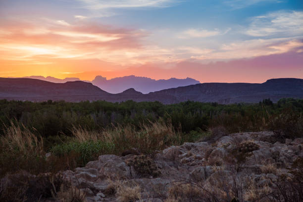 Big Bend Sunset Vibrant sunset skies over the desert landscape at Big Bend. texas mountains stock pictures, royalty-free photos & images