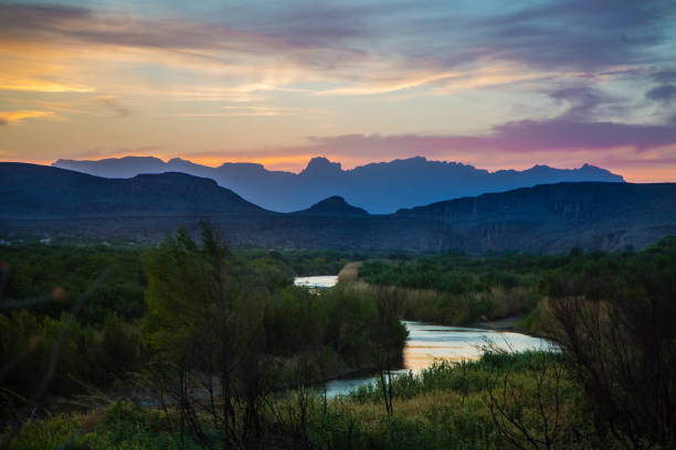 Grande Sunset River Vibrant sunset skies over the desert landscape at Big Bend. texas mountains stock pictures, royalty-free photos & images