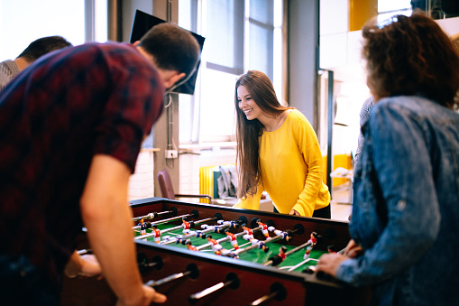 Students playing table soccer