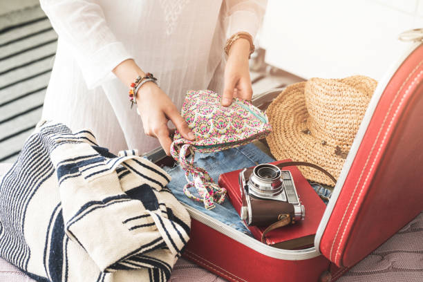 istock Woman preparing summer luggage 987863788