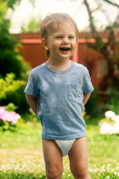 istock Happy baby aged 1,5 years wearing diaper 987875124