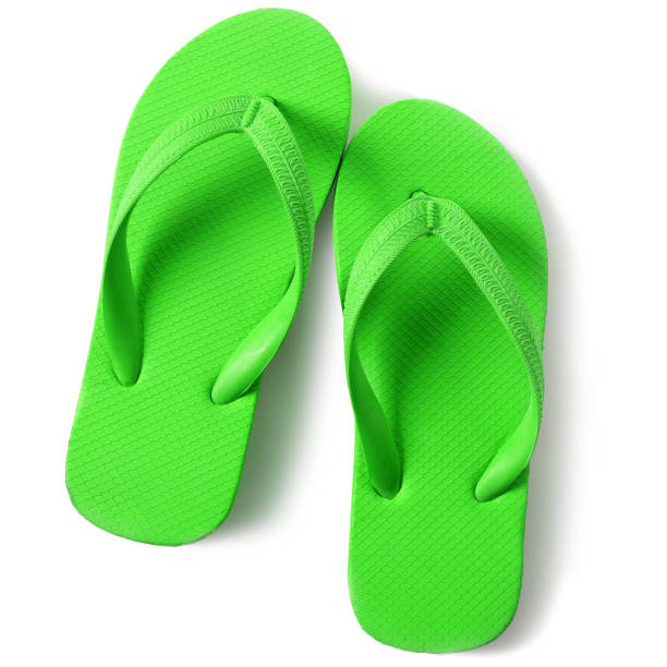istock Bright green flip flop sandals isolated on white background 987887416