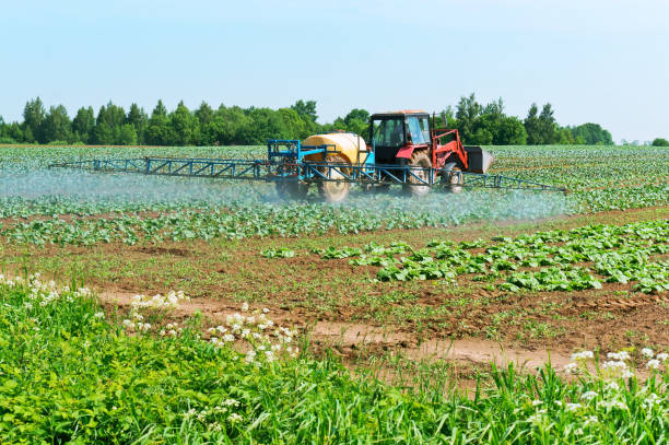 istock agricultural machine sprayer, processing of fields of chemicals, protecting fields against pests 987889900