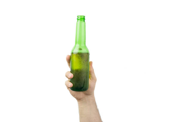 istock Hand Holding Ice Cold Wet Green Beer Bottle Isolated On White  Background 987890948