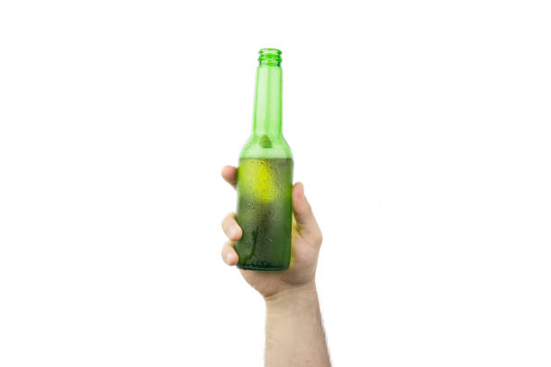 istock Hand Holding Ice Cold Wet Green Beer Bottle Isolated On White  Background 987890982