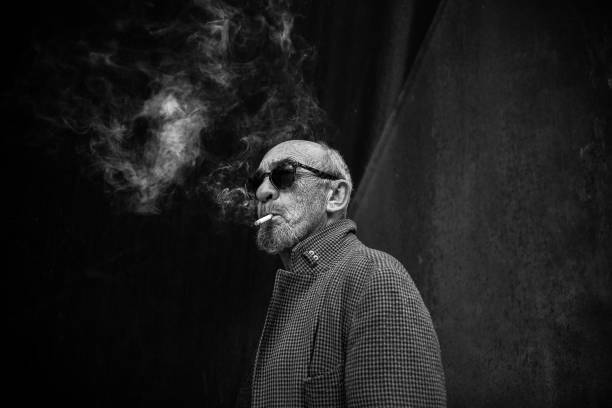 Portrait of a smoking man. Portrait of a smoking man in black and white. smokers wrinkles stock pictures, royalty-free photos & images