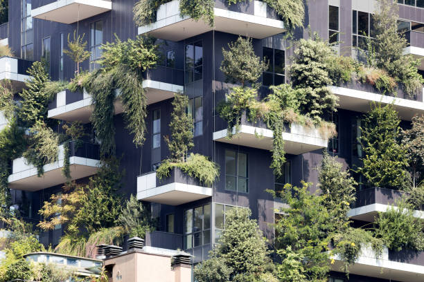 istock Green futuristic skyscraper 987893546