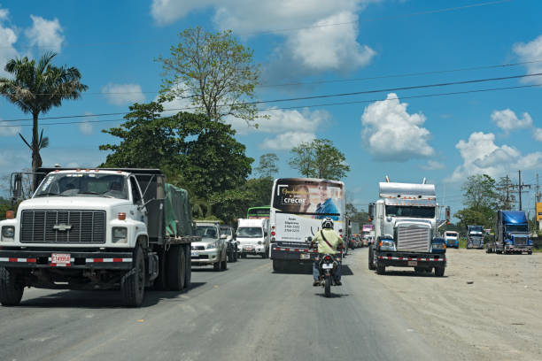 traffic jam on the road 32 east of puerto limon, costa rica puerto limon, costa rica-march 20, 2017: traffic jam on the road 32 east of puerto limon puerto limon stock pictures, royalty-free photos & images