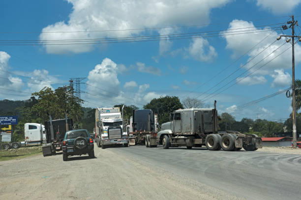 traffic jam on the road 32 east of puerto limon, costa rica puerto limon, costa rica-march 20, 2017: traffic jam on the road 32 east of puerto limon puerto limon stock pictures, royalty-free photos & images