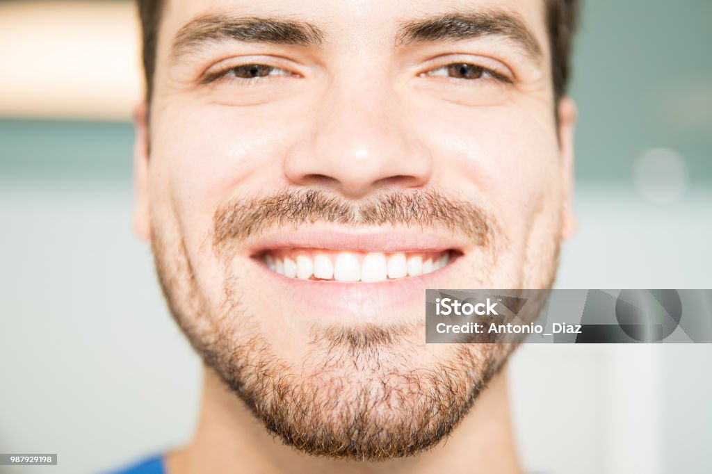 Closeup Of Smiling Mid Adult Man Closeup portrait of smiling mid adult man at dental clinic 30-39 Years Stock Photo