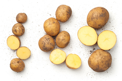 Fresh organic potatoes isolated on white background. Top view