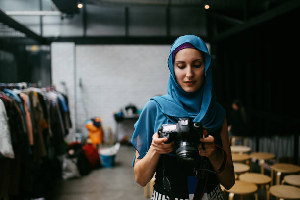 Young woman photographer working in her studio in Kuala Lumpur, Malaysia.