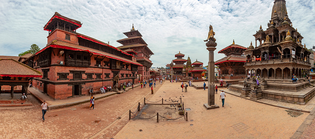 Crowd of tourists and local Nepalese people visit the famous Patan Durbar squar in Kathmandu, Nepal.