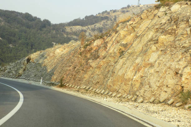 istock Wire mesh as protection from escarpment next to a mountain road 987933460