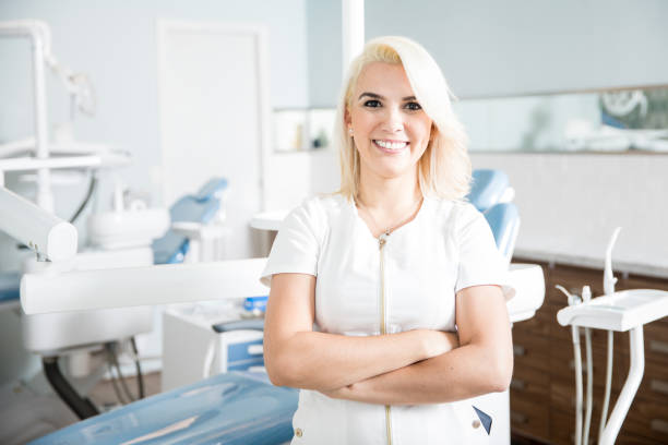 istock Confident and successful dentist in a clinic 987936994