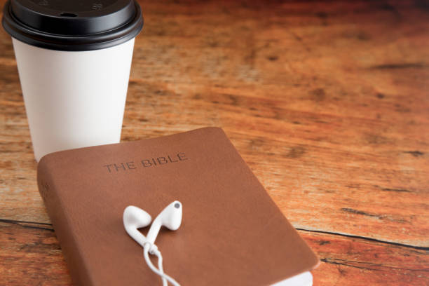 Physical Bible and a Smart Phone with Earphones
