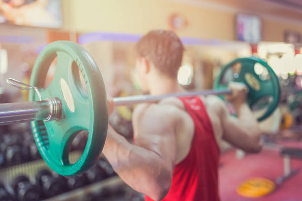 a man lifting a weight lifter
