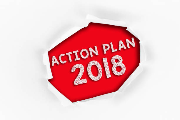 istock Torn paper with a PLANNING 2017 word on red background. 987977402