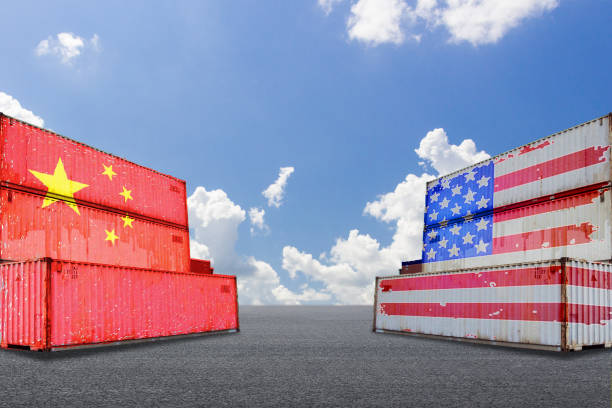 istock Trade warfare, export and import, tariffs, cargo containers, China and the United States 987982984