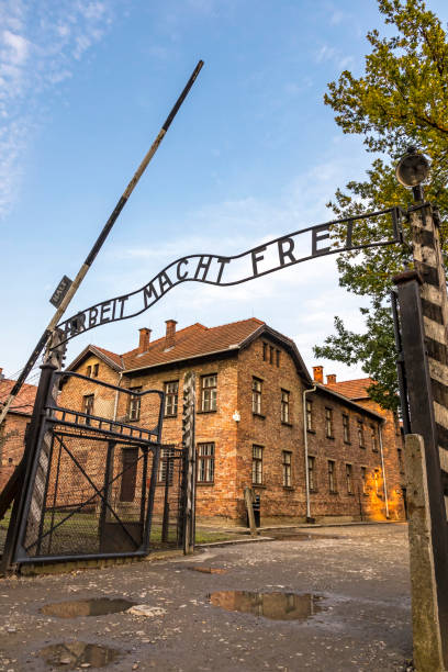 Arbeit macht frei sign in Auschwitz I concentration camp, Oswiecim, Poland AUSCHWITZ, POLAND - AUGUST 27, 2017. Arbeit macht frei sign on the main entrance gateway to Auschwitz-Birkenau (Auschwitz I) concentration camp near Oswiecim city, Poland ethnic cleansing stock pictures, royalty-free photos & images