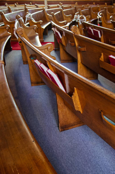 istock Old church pews and aisle 988034600