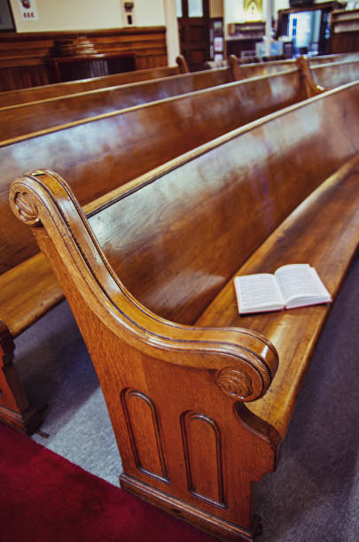 istock Old church pews and aisle 988034716