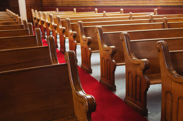 istock Old church pews and aisle 988034726