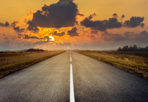 istock country road for background 988065798