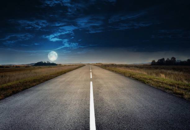 istock country road for background 988065816
