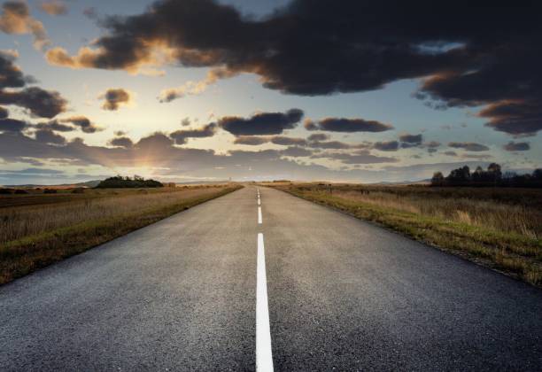 istock country road for background 988065822