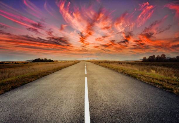 istock country road for background 988065832