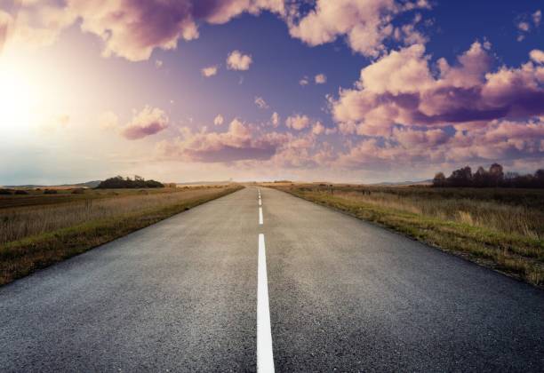 istock country road for background 988065842